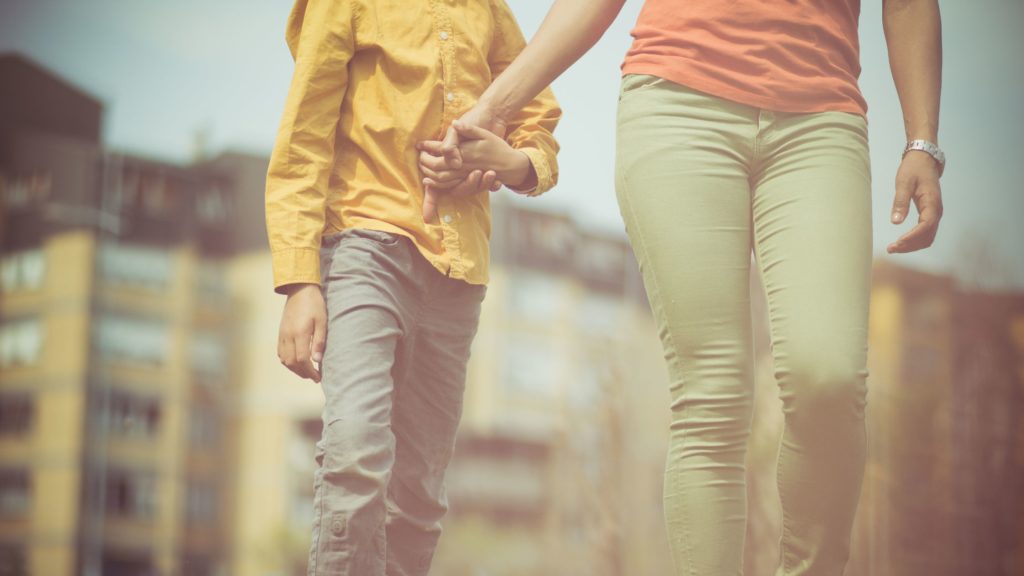 Two people holding hands