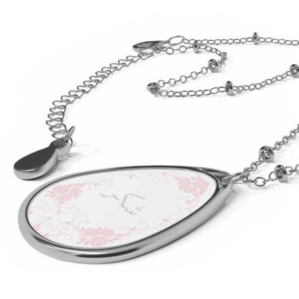shukr chain necklace lying on a surface that's plain